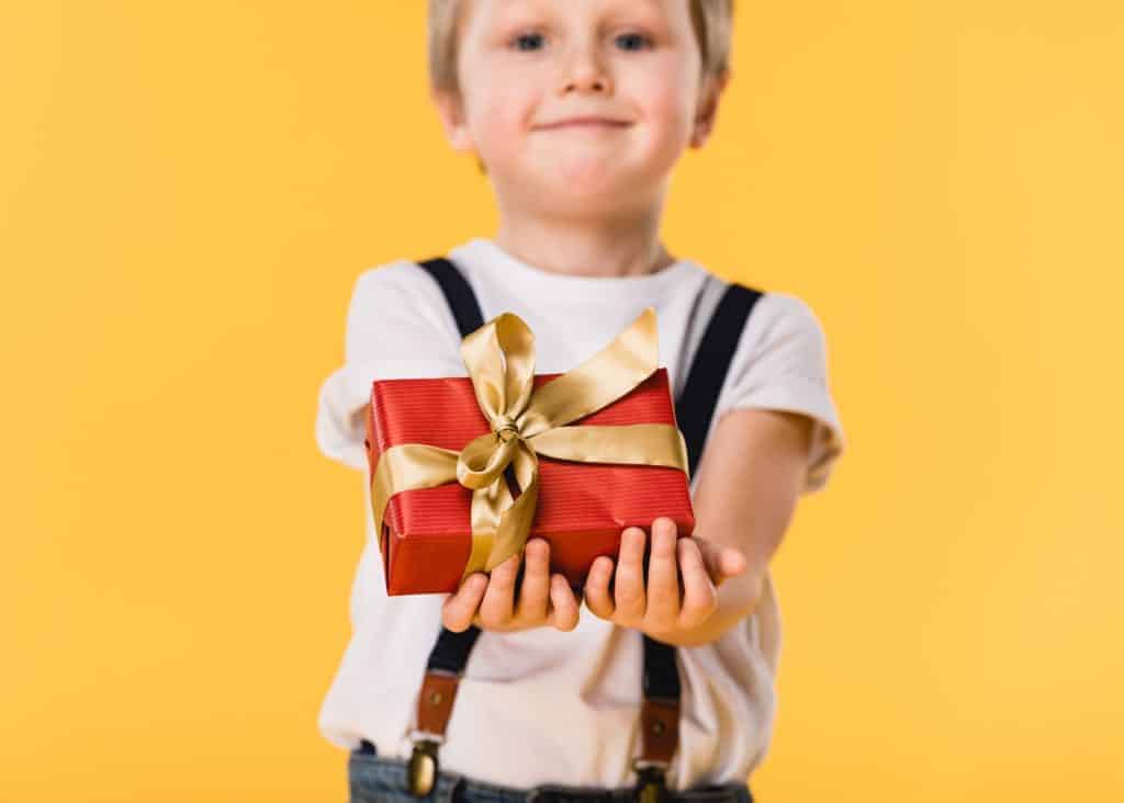 little boy with gifts under $10 for kids