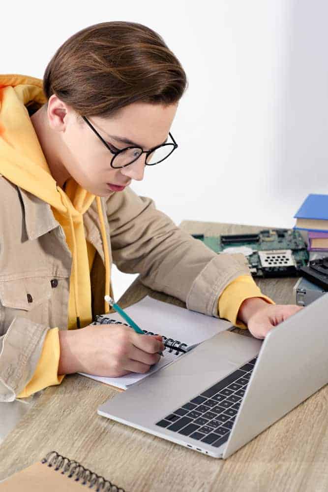 boy on laptop looking for the best online jobs for high school students