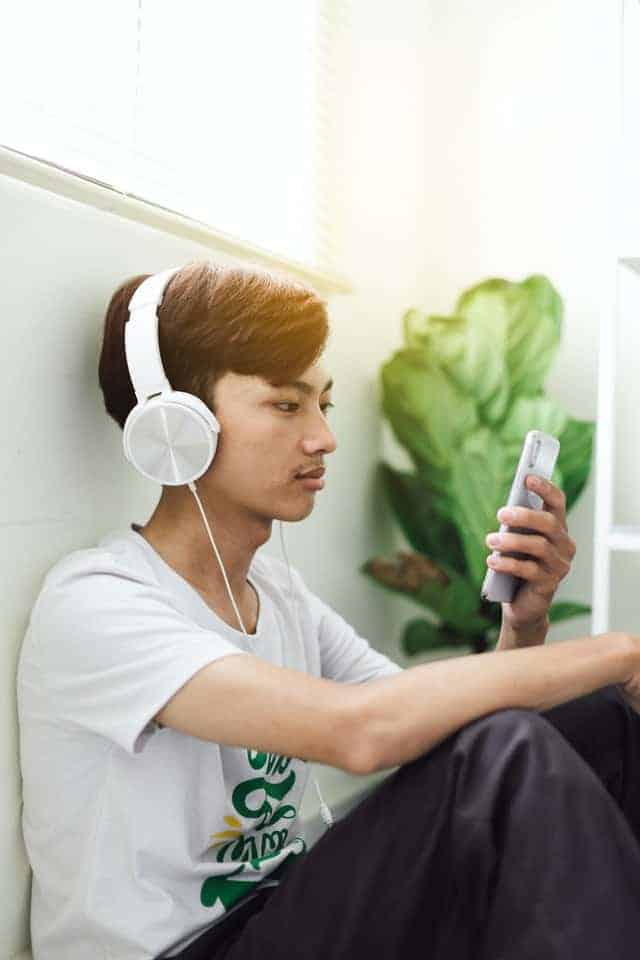boy listening to music as a way to earn money as a 13 year old