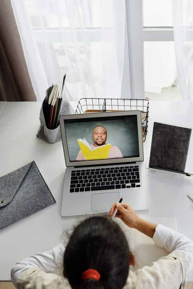 man on video call with child