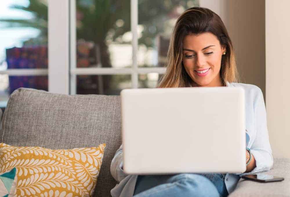 Woman on laptop learning how to become a virtual assistant with no experience.