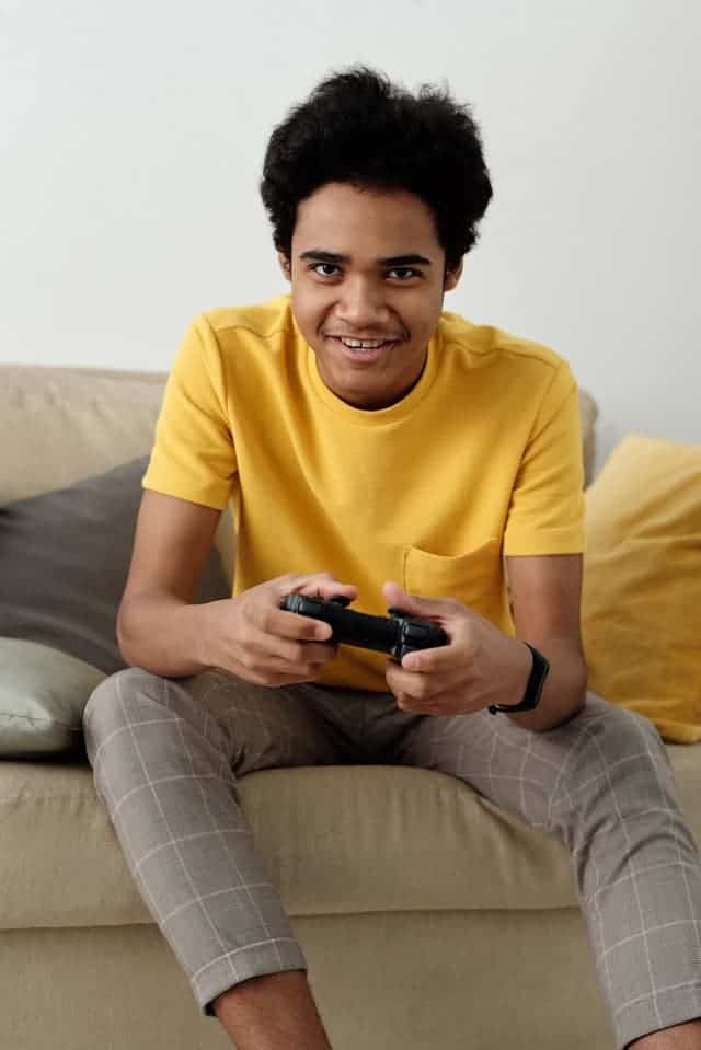 boy playing video game as a way to make money as a teenager without a job online