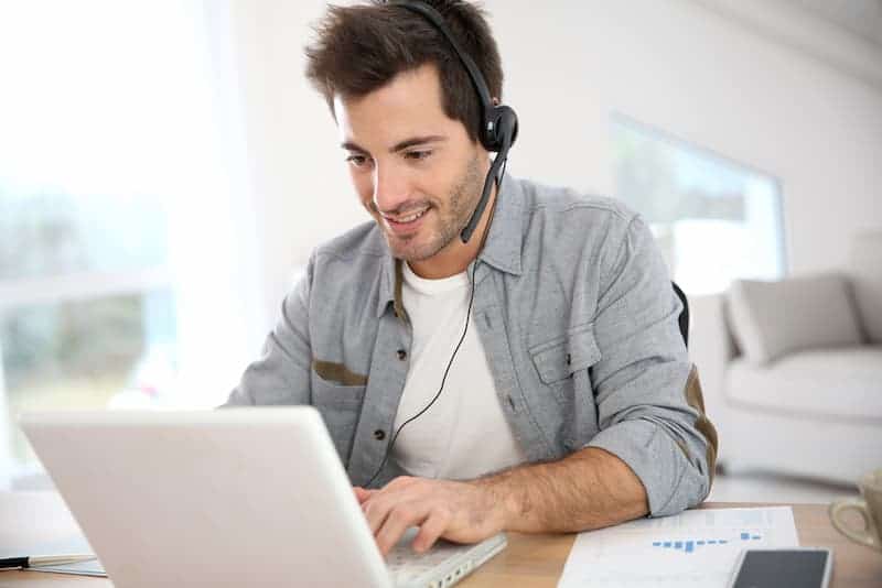 man on laptop looking for immediate hire work from home jobs
