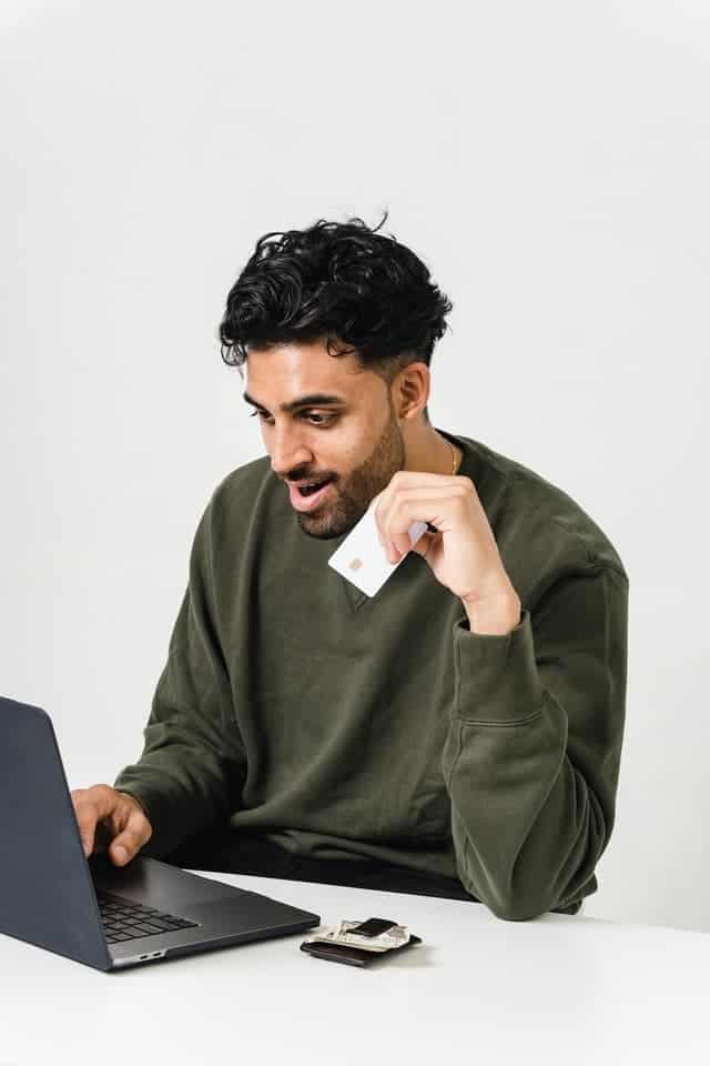 man on laptop shopping online