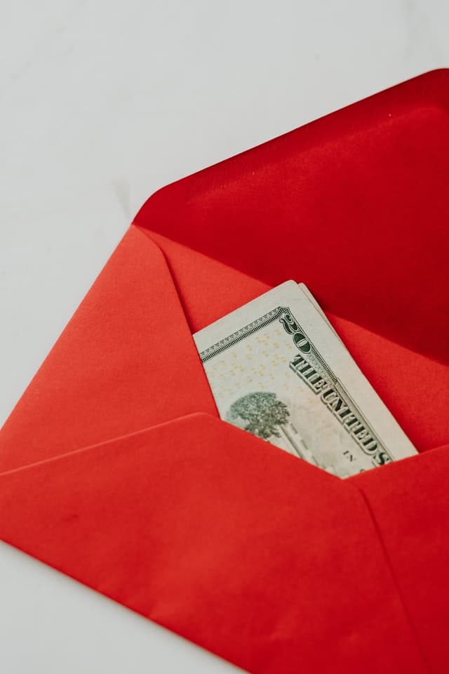 cash in a red envelope as part of the 100 envelope challenge
