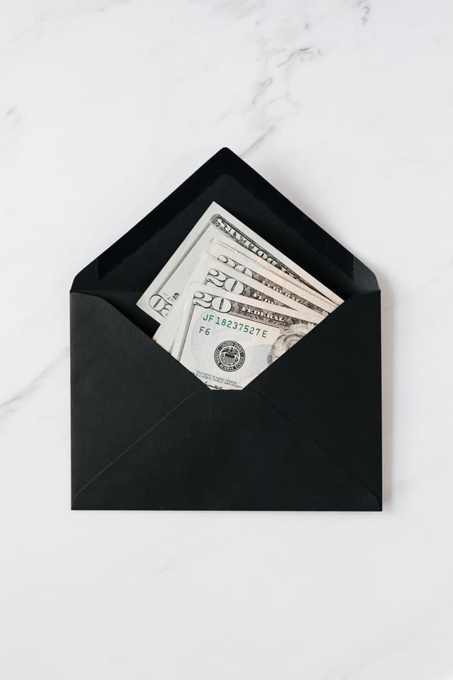 cash in a black envelope as part of the 100 envelope challenge