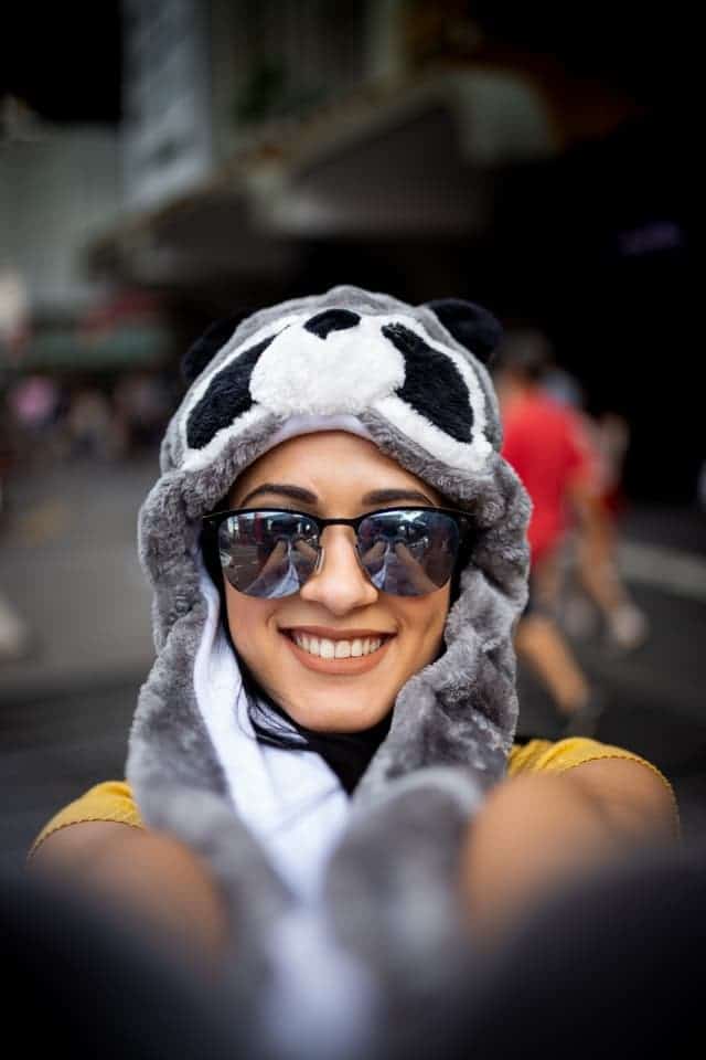 woman in animal hat taking a selfie
