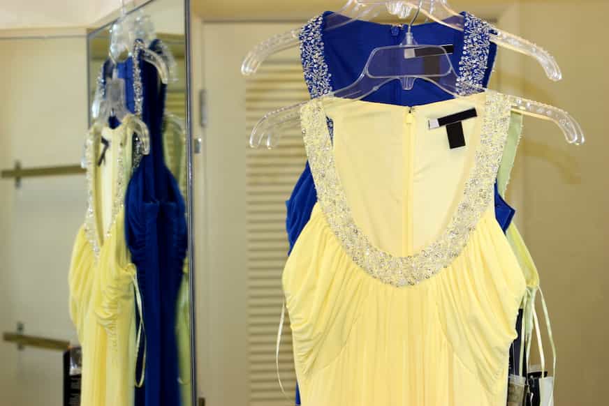 prom dresses on hangers as an example of some of the best things to buy to sell and make money