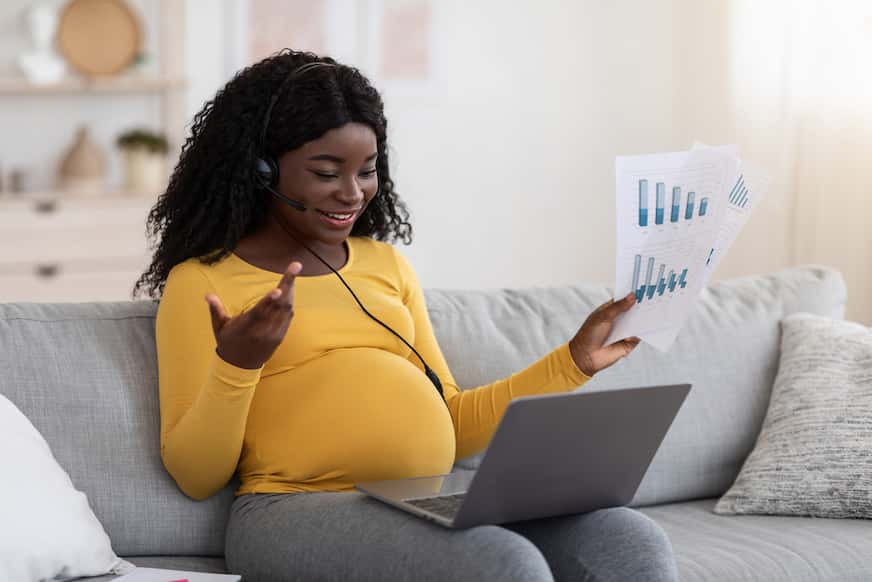 woman working on laptop at one of the best part time jobs for pregnant ladies
