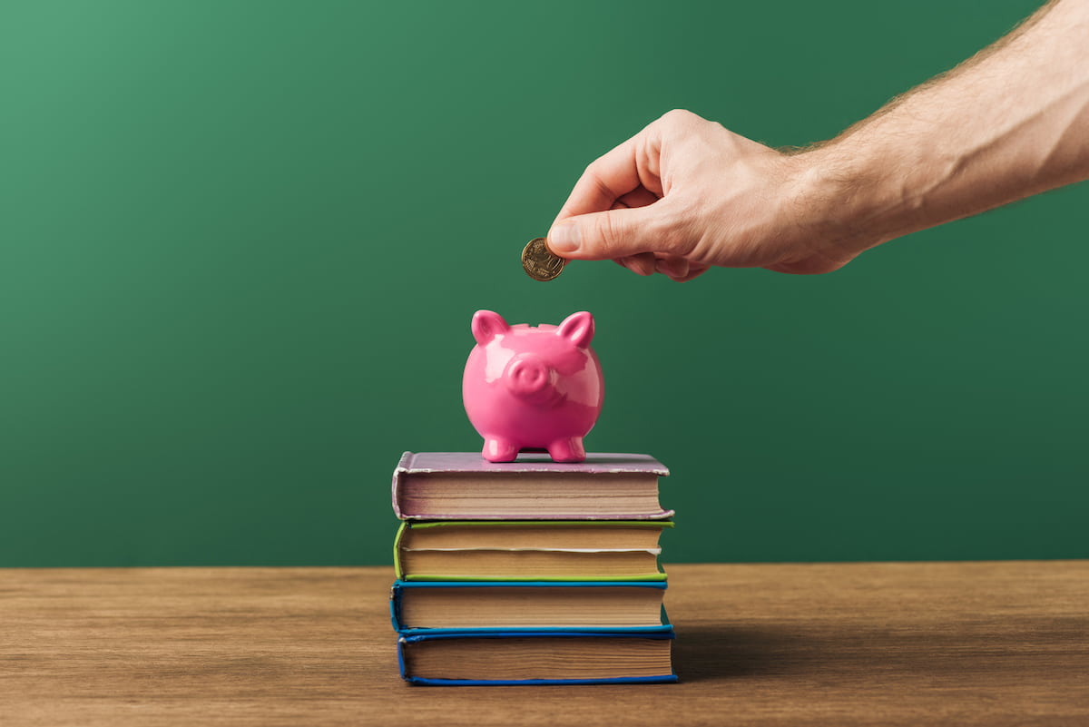 a piggybank above the best books about budgeting