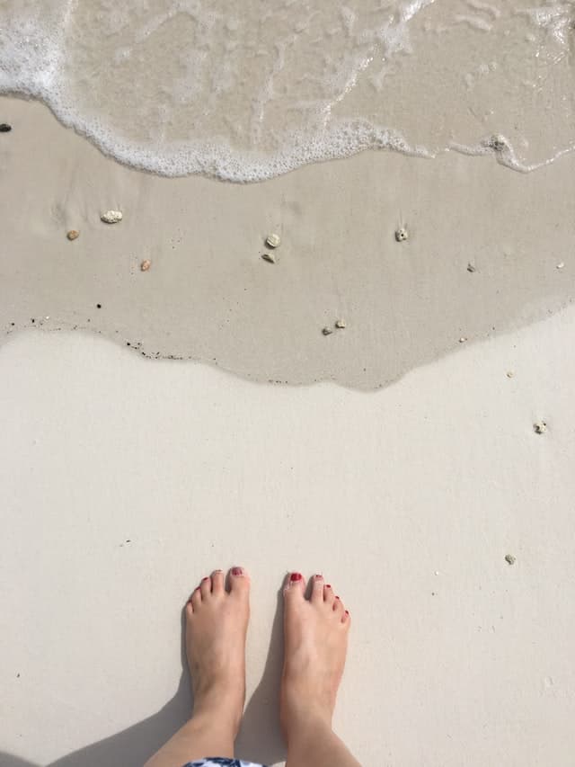 a picture of someone's feet on the beach that you can sell without getting scammed