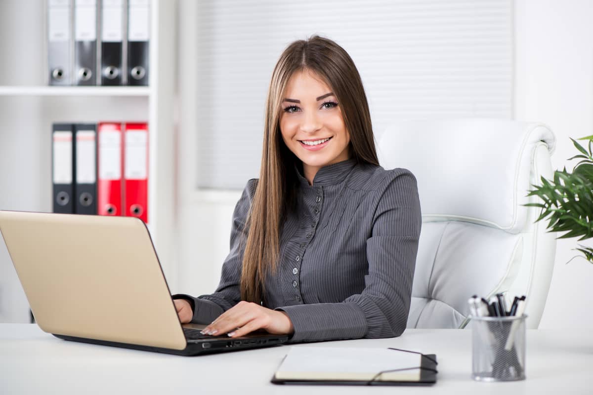 a businesswoman searching business ideas for women in her laptop