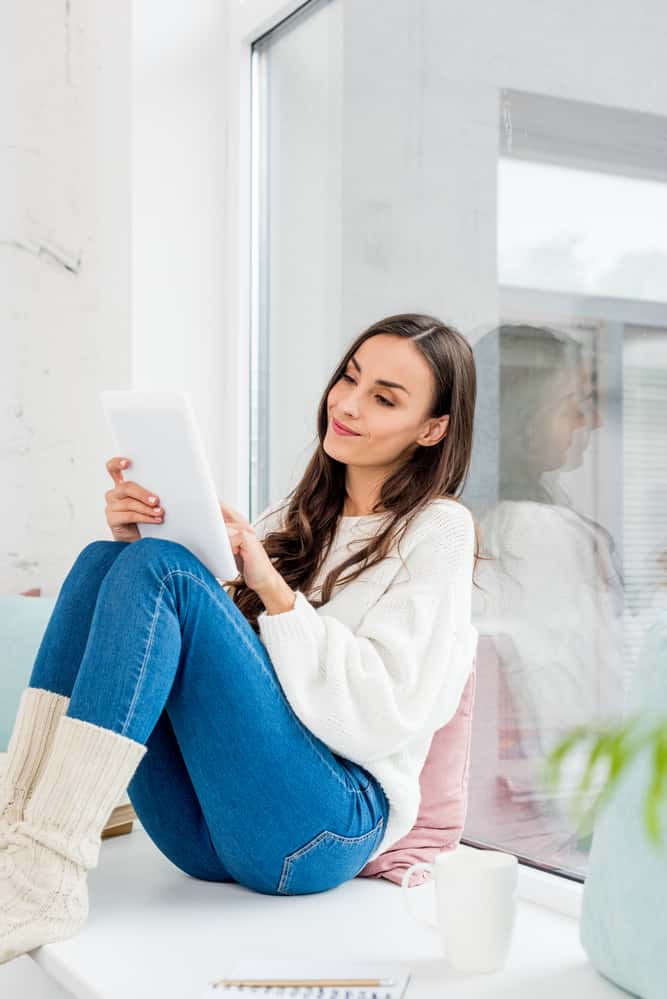 a woman using her tablet