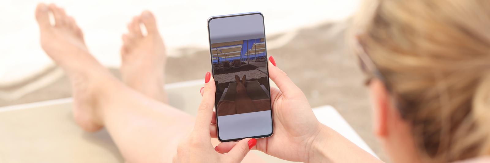 a woman taking feet pics with her phone
