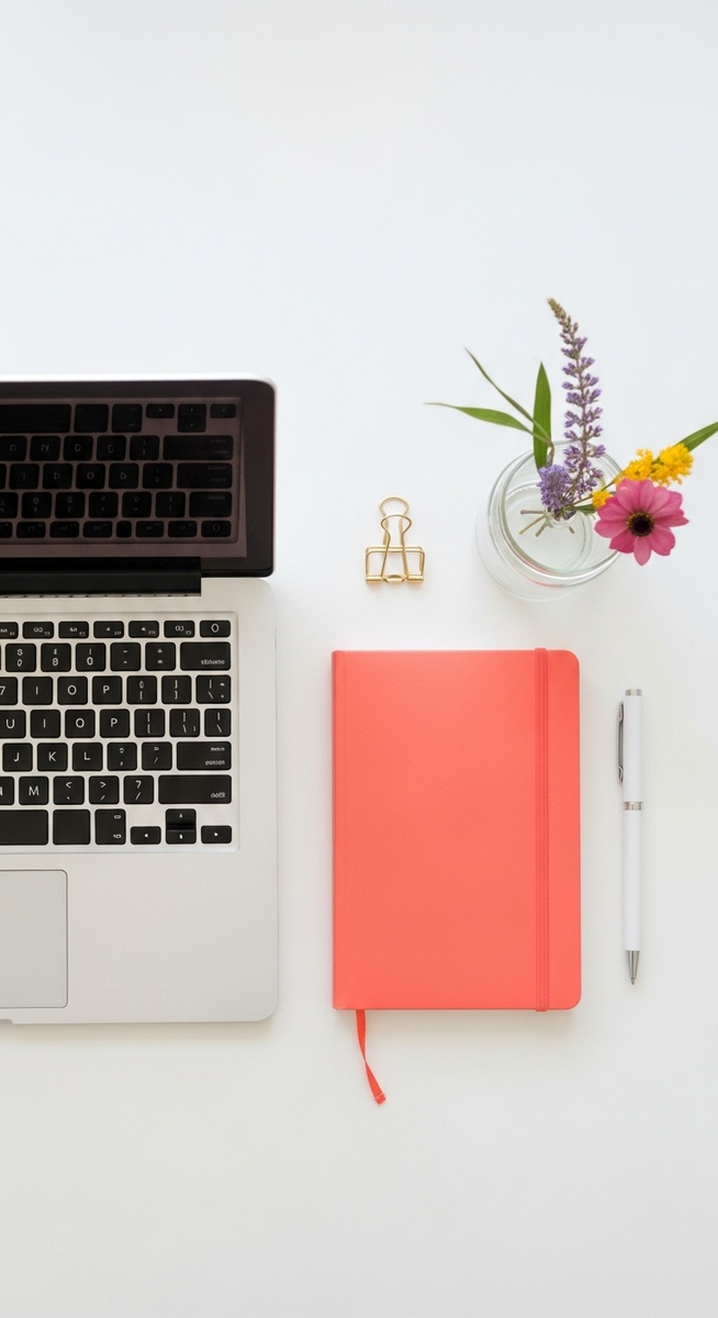 a flatlay with laptop and other items on a white surface to make money
