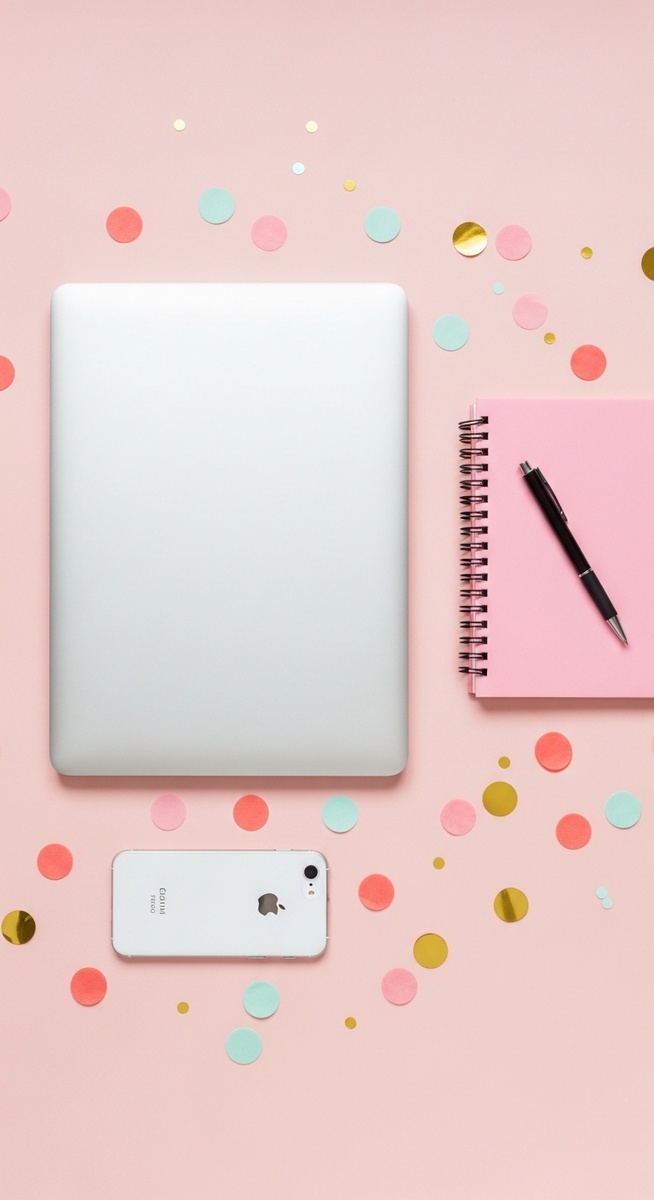 a pink flatlay with laptop, notebook, and phone for virtual assistant work